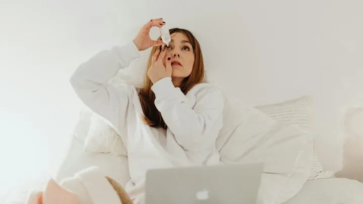 A Woman Using an Eye Drops